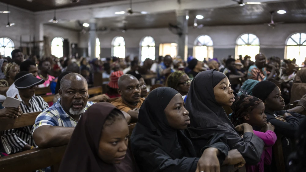 Christians watch a re-enactment of the crucifixion of Jesus during a Good Friday procession in St. Robert Church in Yaba, Lagos, on April 3, 2026. Photo by Olympia De Maismont/AFP via Getty Images.