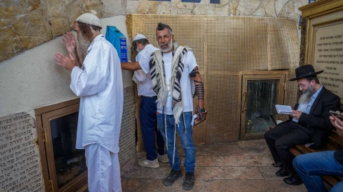 Jews pray at the tomb of Rabbi Akiva, a sage from the latter part of the first century and the beginning of the second, in the northern Israeli city of Tiberias, May 22, 2024. Photo by Ayal Margolin/Flash90.