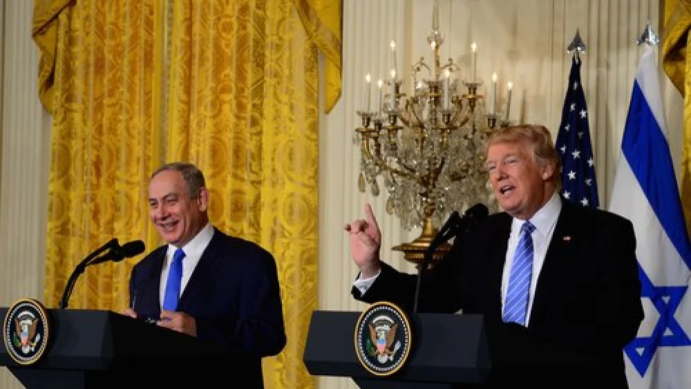 Prime Minister Benjamin Netanyahu (left) and President Donald Trump at their Feb. 15 joint White House press conference, during which Trump broke with the longstanding U.S. stance of wholeheartedly supporting the establishment of a Palestinian state. Credit: Avi Ohayon/GPO.