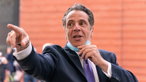 New York Gov. Andrew Cuomo leaves New Settlement Community Center after announcing a partnership with SOMOS Community Care to provide COVID-19 vaccines, March 26, 2021. Credit: Lev Radin/Shutterstock.