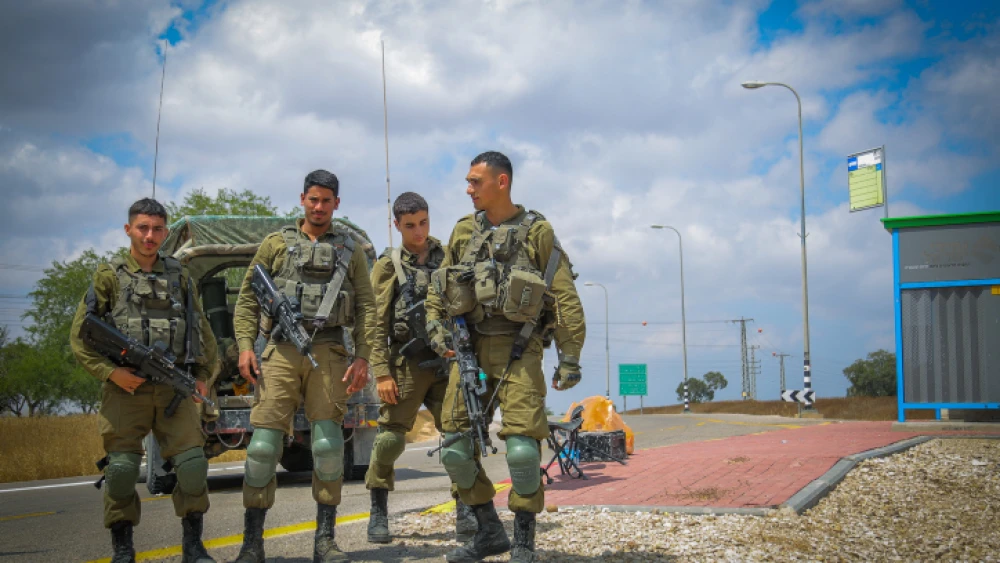 IDF soldiers block a road near the border with the Gaza Strip, May 9, 2023. Credit: Flash90.