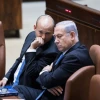 Israeli prime minister Benjamin Netanyahu speaks with Education Minister Naftali Bennett during a plenum session in Knesset in Jerusalem, on Nov. 13, 2017. Photo by Yonatan Sindel/Flash90.