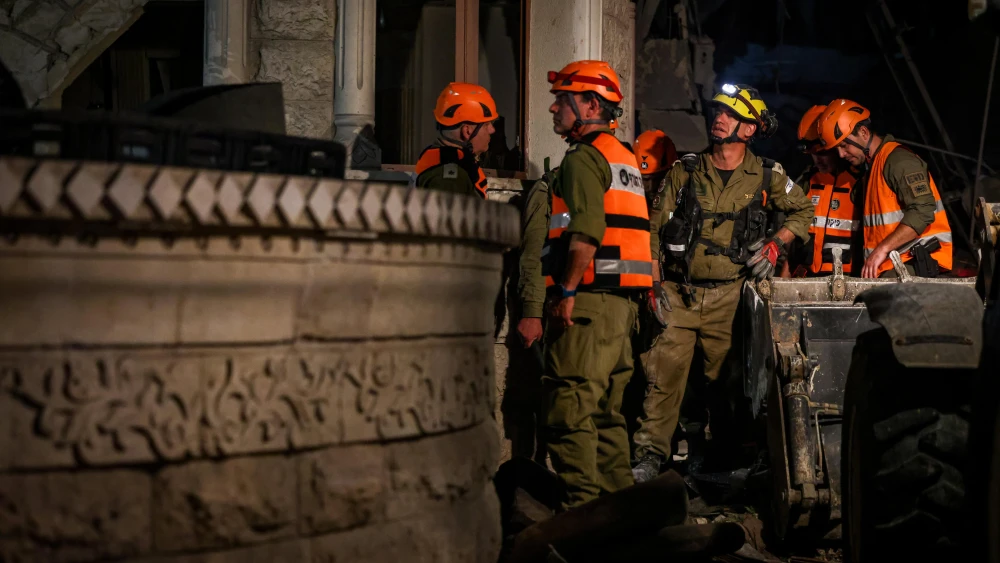 Israeli security and rescue personnel at the scene where a ballistic missile fired from Iran hit in Tamra, the Lower Galilee, June 14, 2025. Photo by David Cohen/Flash90.
