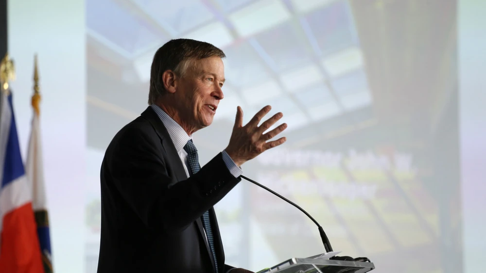 Then-Colorado Gov. John Hickenlooper speaks at the U.S. Department of Energy Solar Decathlon 2017 opening ceremony at the 61st & Peña Station in Denver on Oct. 5, 2017. Credit: Jack Dempsey/U.S. Department of Energy Solar Decathlon.