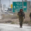 Israeli soldiers near the scene after a Palestinian assailant stabbed a reserve soldier at a bus stop near entrance to Shechem/Nablus, Oct. 11, 2018. Photo by Nasser Ishtayeh/Flash90.