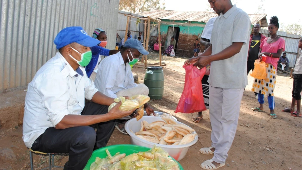 Ethiopia's Jewish community receiving supplied by charitable organizations. Credit: Struggle to Save Ethiopian Jewry.