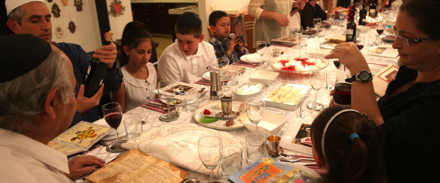 An Israeli family seen during the "Passover Seder" on the first night of the 8-day long Jewish holiday of Passover, in Tzur Hadassah. March 25, 2013 Credit: Nati Shohat/flash 90.