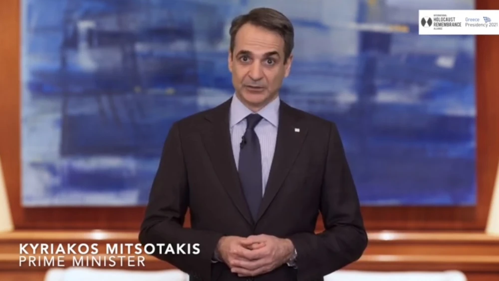 Greek Prime Minister Kyriakos Mitsotakis addresses viewers in an online ceremony of his country's assuming the one-year presidency of the International Holocaust Remembrance Alliance on April 1, 2021. Source: Screenshot.