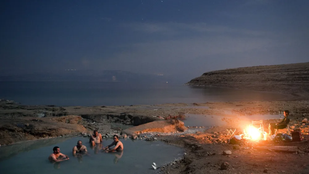 People enjoying the water of the Dead Sea. Photo by Noam Revkin Fenton/Flash 90.
