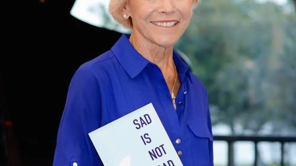 Harriet Vogel with her book, “Sad Is Not Bad: It’s How We Grieve After We’ve Loved.” Vogel met her current love online at age 73—after grieving sufficiently to be open to someone new following the death of her husband. Credit: Courtesy of Harriet Vogel.