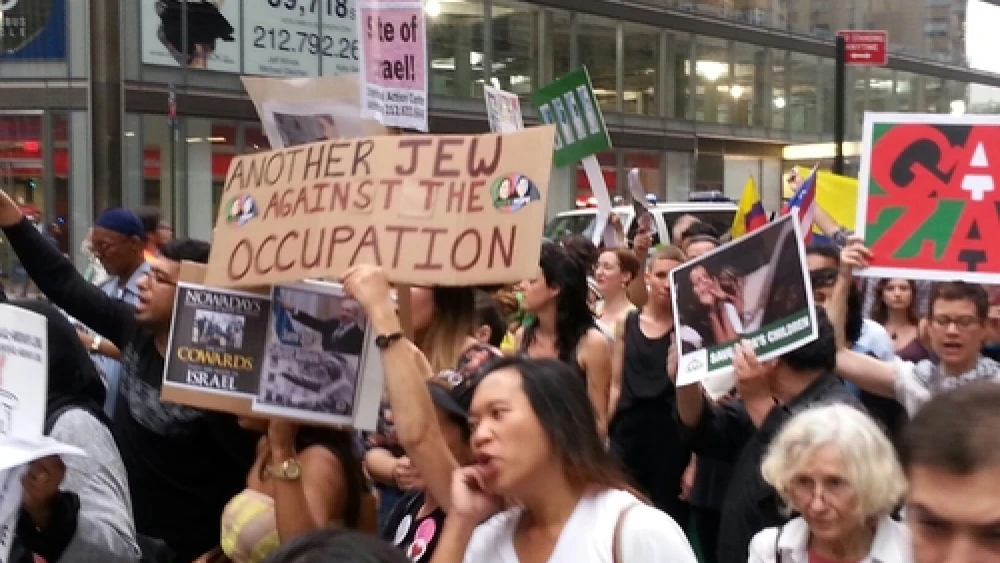An anti-Israel demonstration in Manhattan's Columbus Circle, including a Jewish anti-Zionist sign reading, “Another Jew Against the Occupation.” Credit: Ben Cohen.