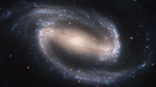 NGC 1300, a spiral galaxy, as photographed by the Hubble telescope. Credit: NASA, ESA, and The Hubble Heritage Team STScI/AURA.