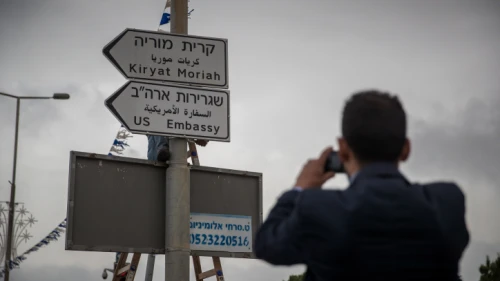 Municipal workers hang a road sign directing to the new U.S. embassy near the U.S. consulate in Jerusalem on May 7, 2018. Photo by Yonatan Sindel/Flash90.