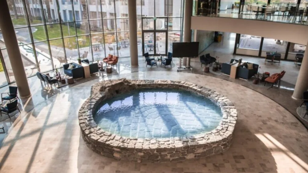 A fishpond restored from the ancient village in the center of the Magdala Hotel lobby. Photo courtesy of Magdala Tourism Center