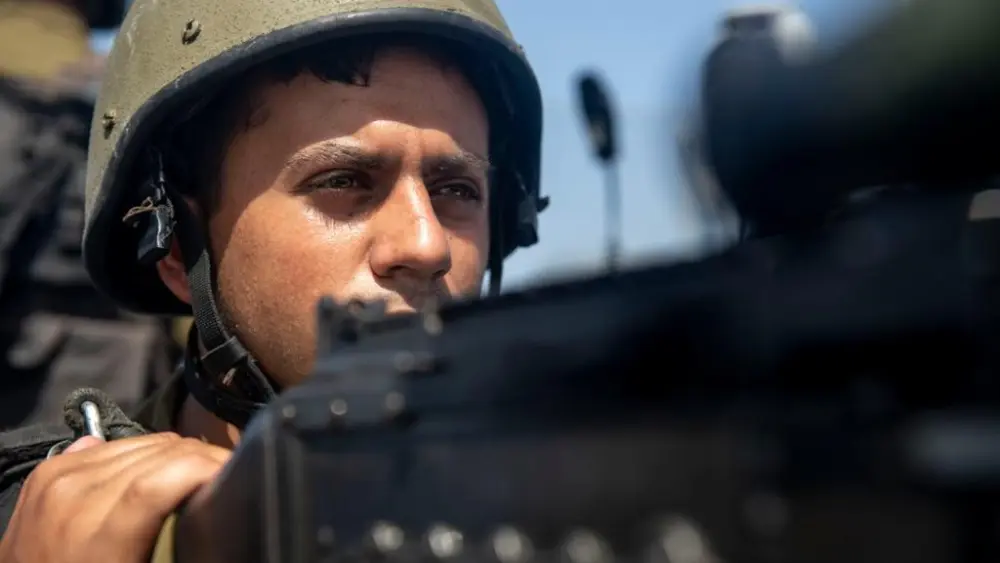 An Israeli sailor manning a gun on an naval ship. Credit: IDF Spokesperson's Unit.