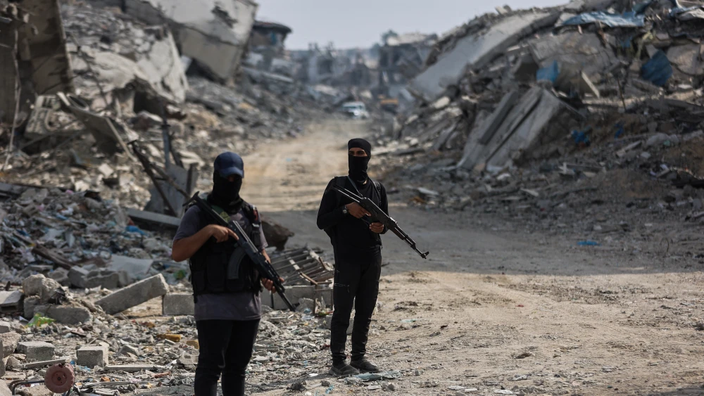 Armed Hamas terrorists stand guard in Gaza City, Nov. 3, 2025. Photo by Omar al-Qattaa/AFP via Getty Images.