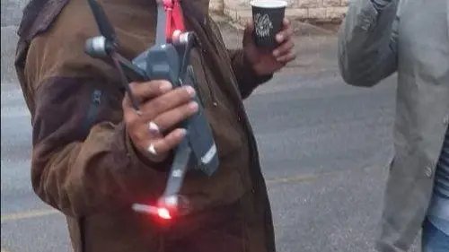 A Lebanese man holds an Israeli drone he allegedly shot down in southern Lebanon, Oct. 23, 2019. Source: Screenshot.