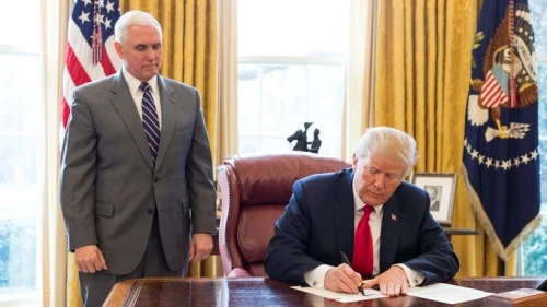 U.S. President Donald Trump, joined by Vice President Mike Pence, signs an executive order on March 19, 2018. Credit: Official White House Photo by Joyce N. Boghosian.