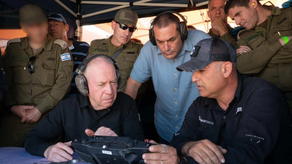 Minister of Defense Yoav Gallant views a controller screen during drone interception tests, Oct. 14, 2024. Photo by Ariel Hermoni/Ministry of Defense.
