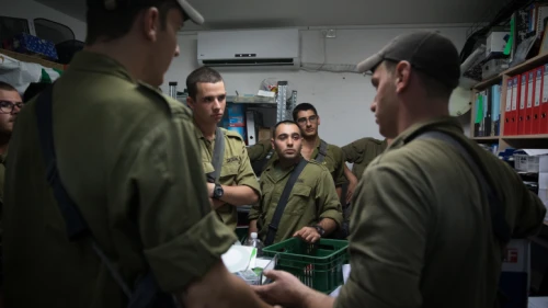 Israeli soldiers stand inside a street-level bomb shelter as a siren warns of incoming rockets fired from Gaza into Israel on Nov. 12, 2018. Photo by Hadas Parush/Flash90.