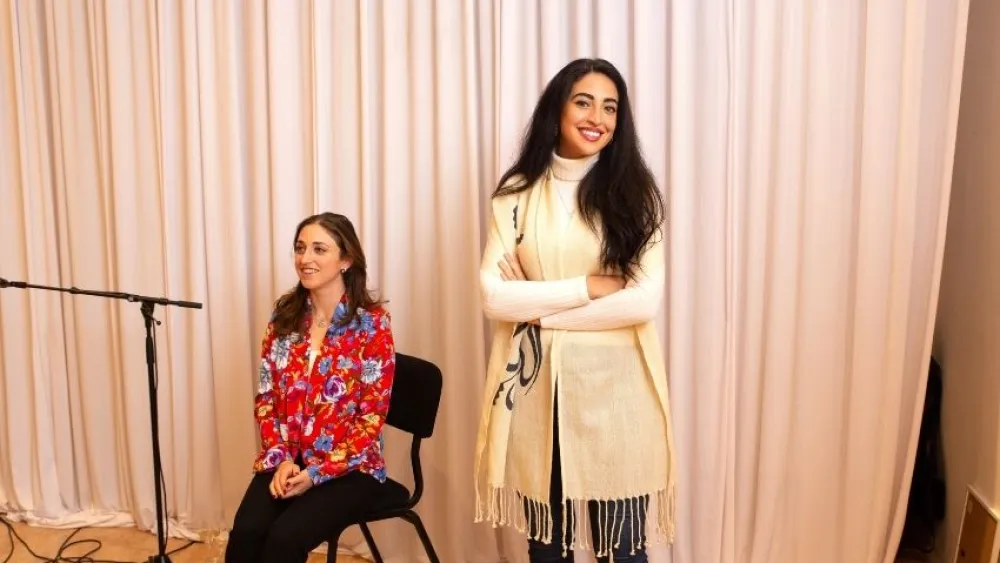 Dubai-based Moroccan-born artist Chama Mechtaly (right) and Jerusalem-based, Syrian-American artist Lenore Cohen Mizrachi at the exhibition, Nov. 20, 2021. Credit: Courtesy.