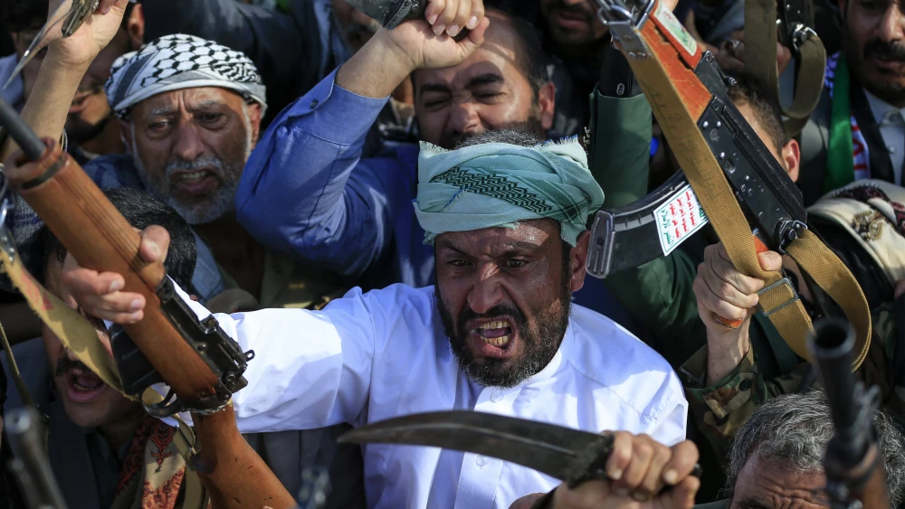 Supporters of the Iran-backed Houthi terrorist movement brandish their weapons as they rally in solidarity with Iran and Lebanon in the Yemeni capital Sanaa on April 10, 2026. Photo by Mohammed Huwais / AFP via Getty Images.