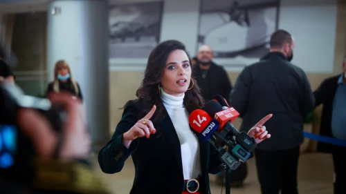 Ayelet Shaked speaks to reporters at Ben-Gurion Airport, March 13, 2022. Credit: Roy Alima/Flash90.