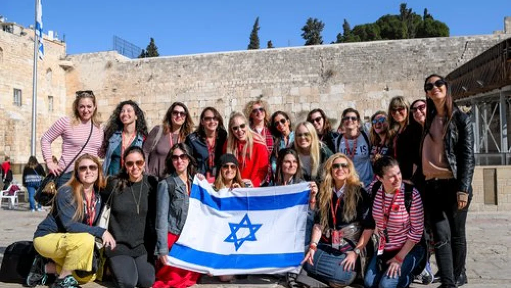 Participants of the Jewish Women’s Renaissance Project’s “Media Magnets” trip to Israel are pictured at the Western Wall in Jerusalem. Credit: Aviram Valdman.