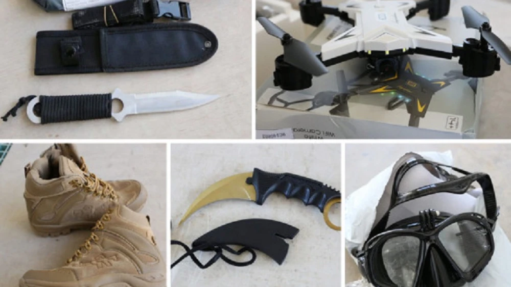 Dual-use goods confiscated by Israel at the Erez Border Crossing into the Gaza Strip. Among them were military and electronic equipment such as skimmers, knives, scuba gear, drones, satellite communications equipment, binoculars and more. Source: Office of the Coordinator of Government Activities in the Territories.