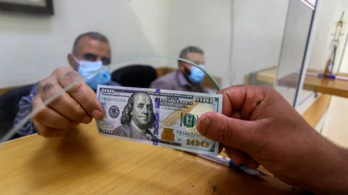 Palestinians receive financial aid from Qatar at a post office in Rafah in the southern Gaza Strip on Oct. 6, 2020. Photo by Abed Rahim Khatib/Flash90.