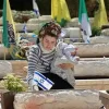 Meitar Eliyahu, the widow of St. Sgt. (res.) Yedidya Eliyahu, at his grave at the Mount Herzl Military Cemetery in Jerusalem. Photo by Oren Cohen.
