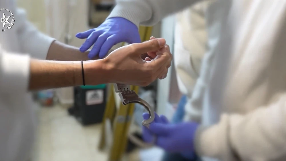 Suspect handcuffed by police