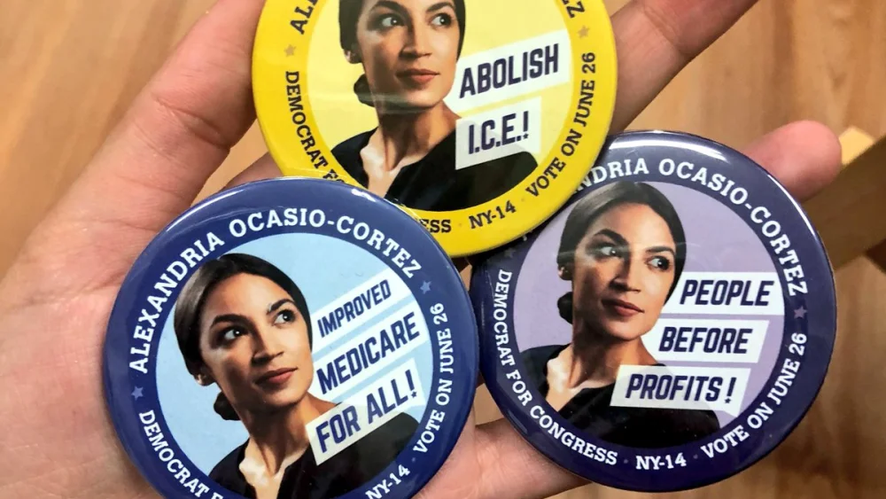 Campaign buttons for Alexandria Ocasio-Cortez, a Democratic Socialist who led a surprise upset victory over Rep. Joe Crowley (D-N.Y.) in a Democratic Party primary on June 27. Credit: Twitter.