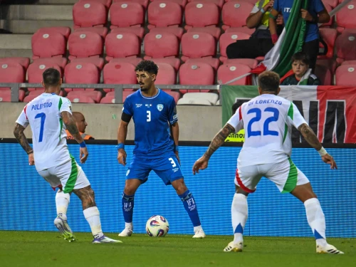 Israel national team left-back Roy Revivo faces off against Italian players during an Israeli "home" game World Cup qualifying match at Nagyerdei Stadion in Debrecen, Hungary, on Sept. 8, 2025. Credit: Flash90.