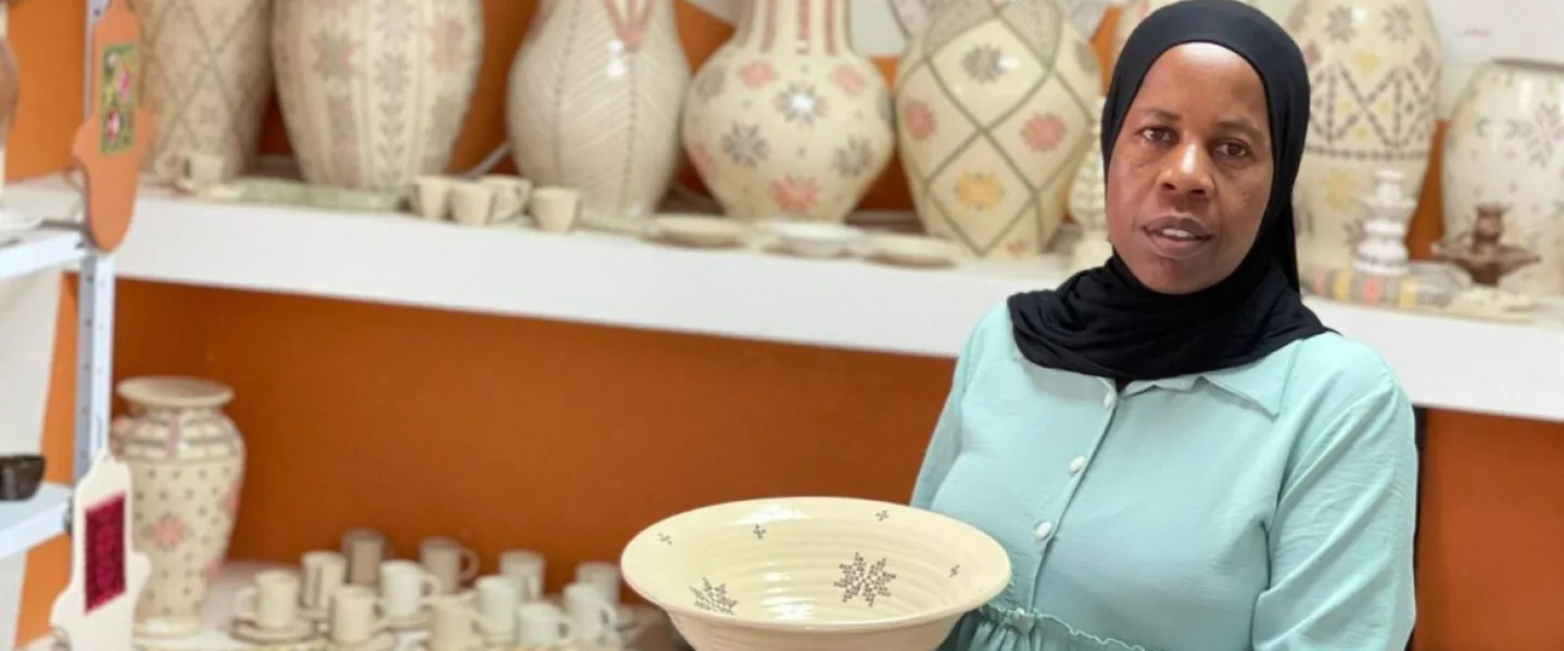 Artist Zenab Grabia with one of her many unique artworks at her gallery in the Bedouin town of Segev Shalom in the Negev Desert. Photo courtesy of Zenab Grabia.