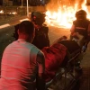 Israeli medics evacuate an injured man during Arab-Jewish riots in Akko on May 12, 2021. Photo by Roni Ofer/Flash90.