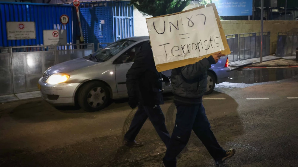 Israelis Hold Sign Calling UNRWA Terrorists