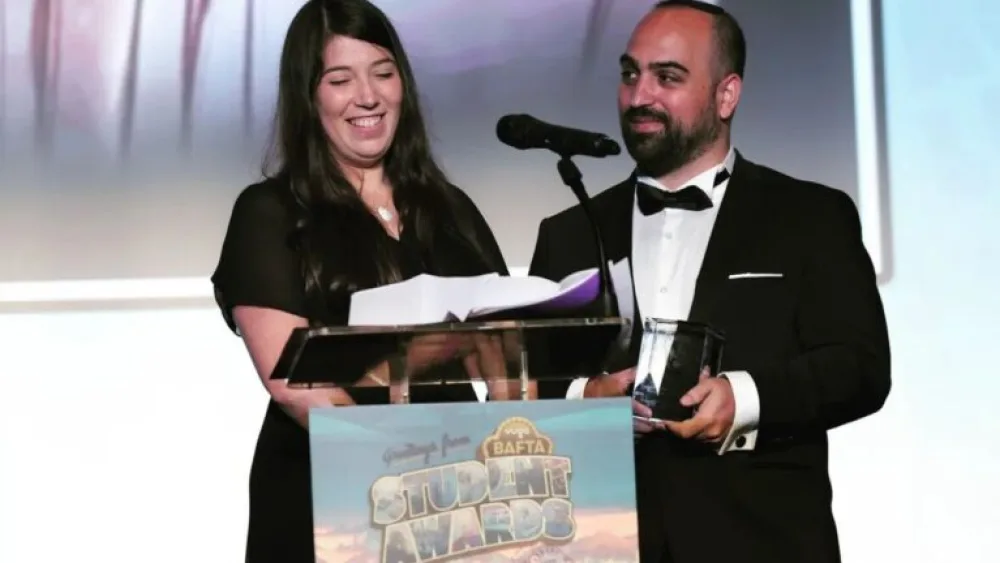 Writer/director Shulamit Lifshitz is presented with the “Best Live Action Film” award by the British Academy of Film and Television Arts) Student Awards for her film “Girl No. 60427.” Source: Screenshot.