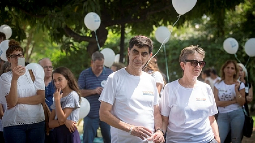 Leah and Simcha Goldin, the parents of late IDF Lt. Hadar Goldin, whose body is being held by Hamas in Gaza, attend a rally outside of Israel's Ministry of Defense in Tel Aviv on Aug. 31, 2018, calling on the government to do more to return the bodies of Goldin and IDF soldier Oron Shaul. Credit: Miriam Alster/Flash90.