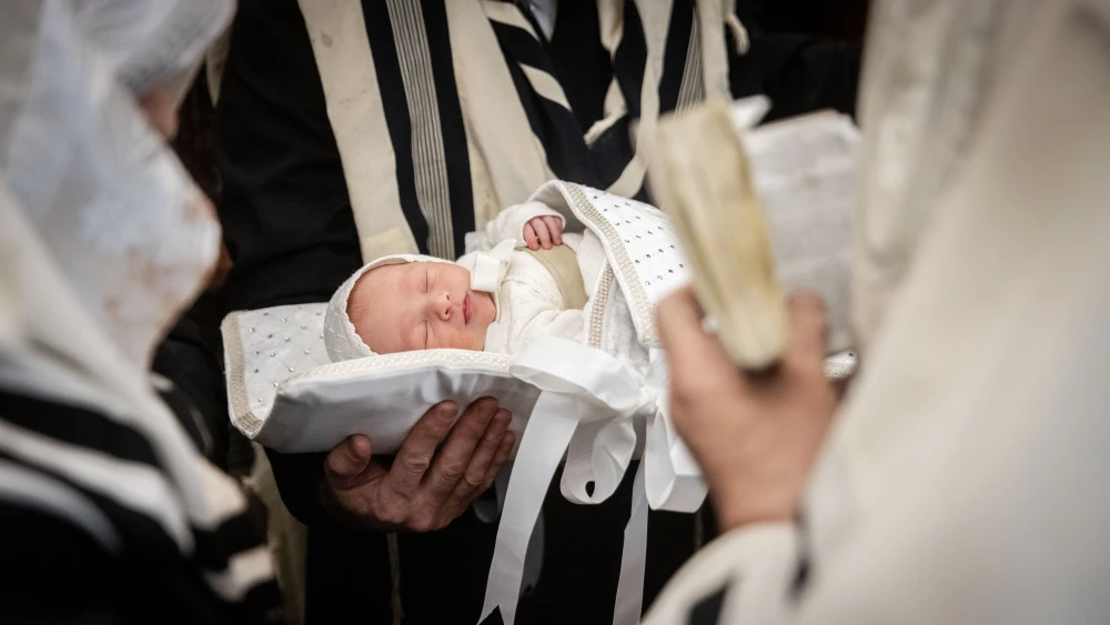 Haredi Jews perform a brit milah ceremony in the Mea She’arim neighborhood of Jerusalem on Dec. 29, 2024. Photo by Chaim Goldberg/Flash90.