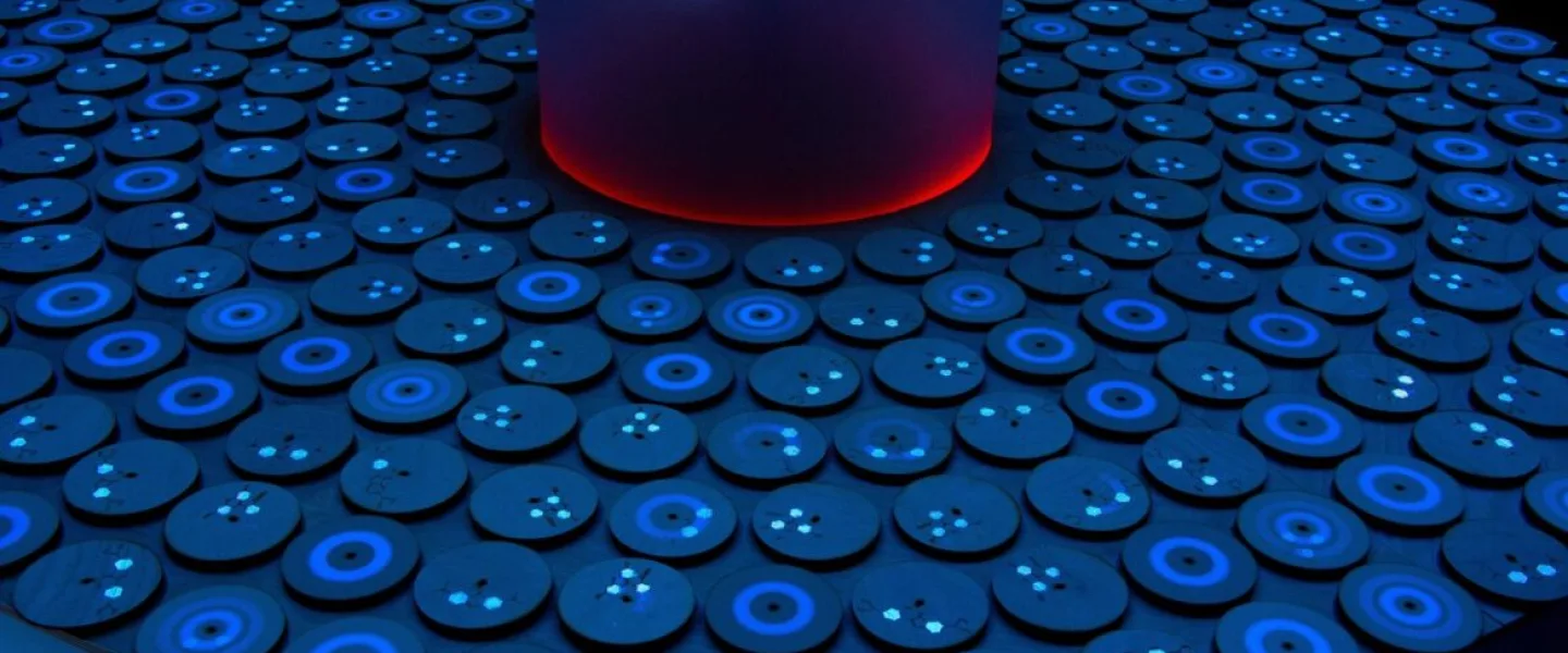 Ela Goldman’s spinning and resting tops carry fluorescent molecules to illustrate professor Dror Fixler's experiments using gold nanoparticles to detect disease. Photo by Michael Amar.