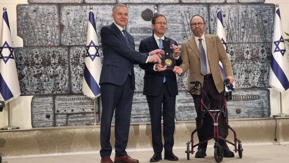 Israeli President Isaac Herzog presents the Presidential Medal of Honor to Israel Bonds Global President and CEO Dani Naveh and U.S. and International Chairman Andrew M. Hutter at the President’s Residence in Jerusalem, Oct. 12, 2026. Photo by Sharon Altshul.