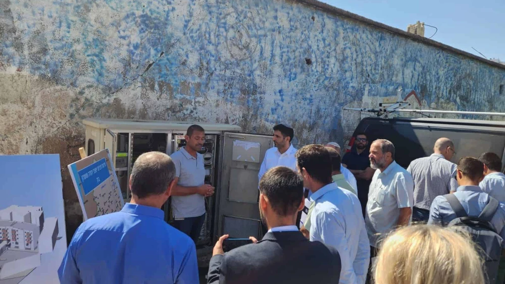 Israeli Communications Minister Shlomo Karhi (background, center right) attends a ceremony in Hebron marking the connection of the city to a fiber-optic cable network, Aug. 22, 2023. Credit: Courtesy.