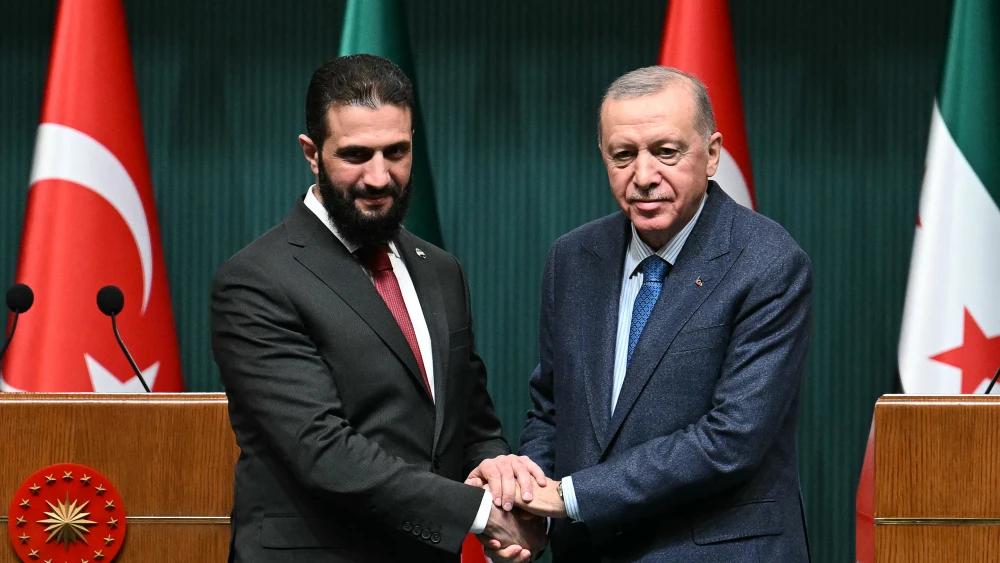 Syria's then-interim President Ahmed al-Sharaa and Turkish President Recep Tayyip Erdoğan pose during a joint press conference following their meeting at the Presidential Palace in Ankara on Feb. 4, 2025. Photo by Ozan Kose/AFP via Getty Images.