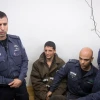 Police escort a Palestinian charged with the murder of 19-year-old Ori Ansbacher, at the Jerusalem Magistrate's court, on Feb. 11, 2019. The suspect was captured hiding in Ramallah after Israeli forces investigated the scene where the young woman was found dead last week in Ein Yael, in the outskirts of Jerusalem. Photo Yonatan Sindel/Flash90.