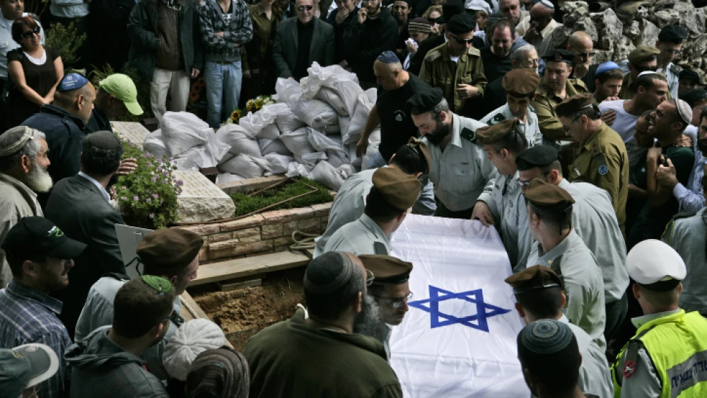 IDF soldiers carry the flag-draped coffin of their comrade, Maj. Eliraz Peretz, during his funeral at the Mount Herzl military cemetery in Jerusalem March 28, 2010. Photo by Abir Sultan/Flash 90.