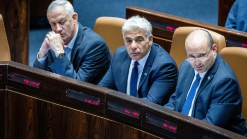 Israeli Prime Minister Naftali Bennett, Foreign Minister Yair Lapid Defense Minister Benny Gantz attend a vote on the "settler law" bill at the Knesset, June 6, 2022. Photo by Yonatan Sindel/Flash90.