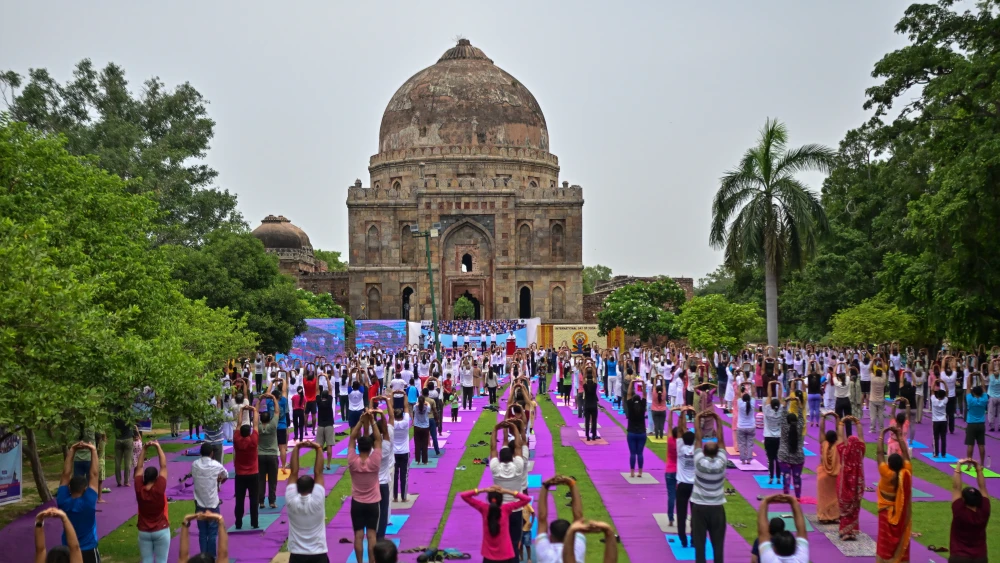 Participants attend a mass yoga session marking the observance of International Day of Yoga at a public park on June 21, 2026 in New Delhi, India. Photo by Ritesh Shukla/Getty Images.