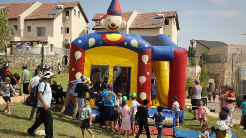 Families enjoy a Sukkot holiday festival in the settlement of Efrat on Oct.16, 2019. Photo by Gershon Elinson/Flash90.