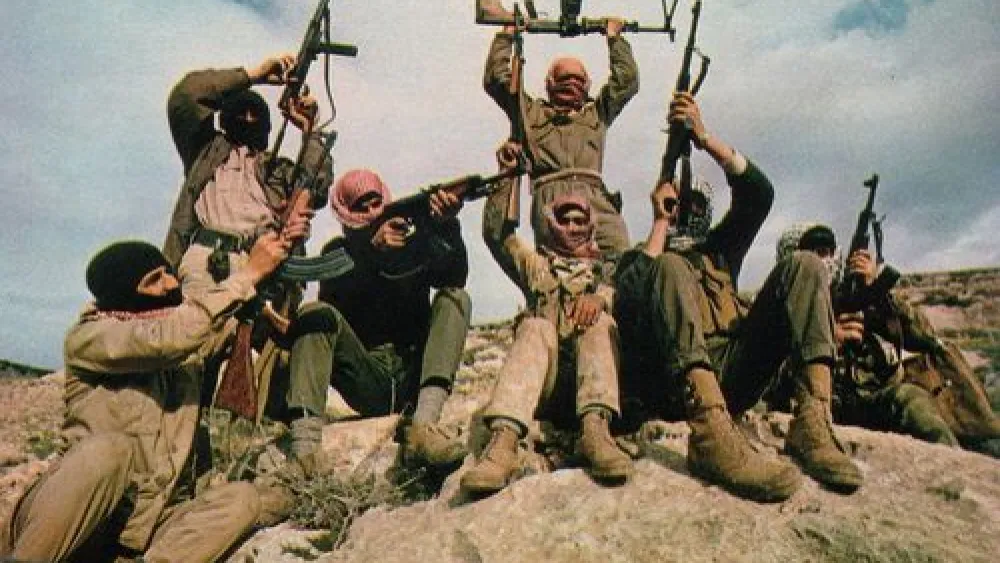 Click photo to download. Caption: Members of the Popular Front for the Liberation of Palestine (PFLP) terror group are pictured flaunting their weapons in the mountains east of the Jordan River. The PFLP carried out the August 1976 terror attack at the El Al Terminal in the Istanbul airport, killing four people, including 29-year-old Harold W. Rosenthal. Credit: Thomas R. Koeniges via Wikimedia Commons.